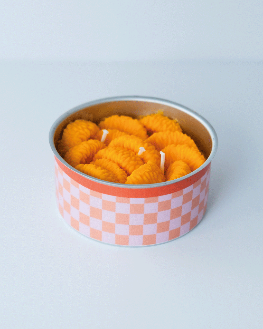 Vela en lata de mandarina